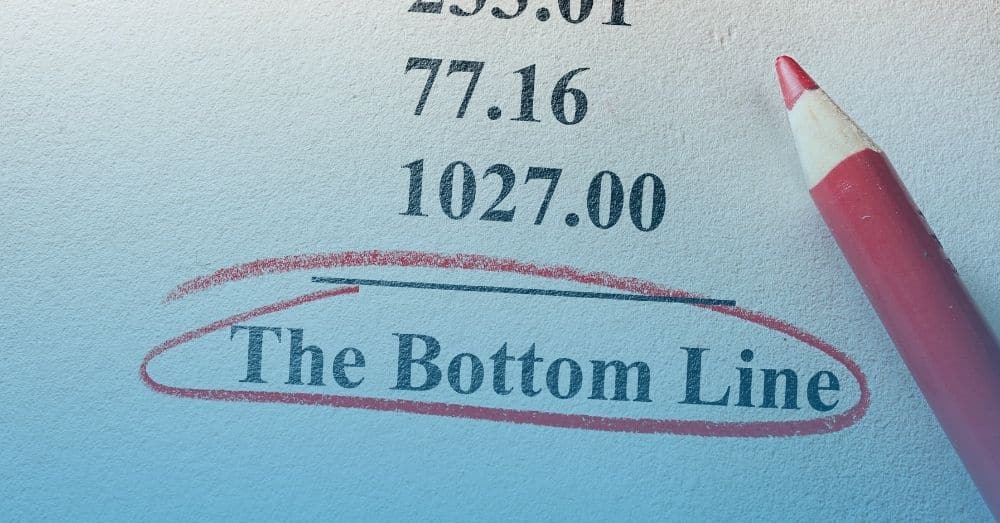 photo showing some numbers with a line and words that say The Bottom Line circled in red pencil