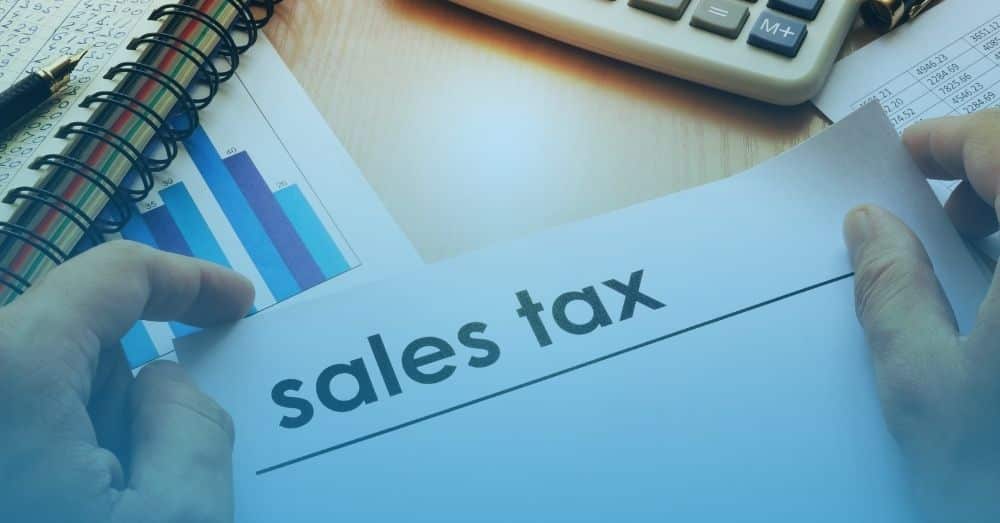 sales tax with calculator and papers