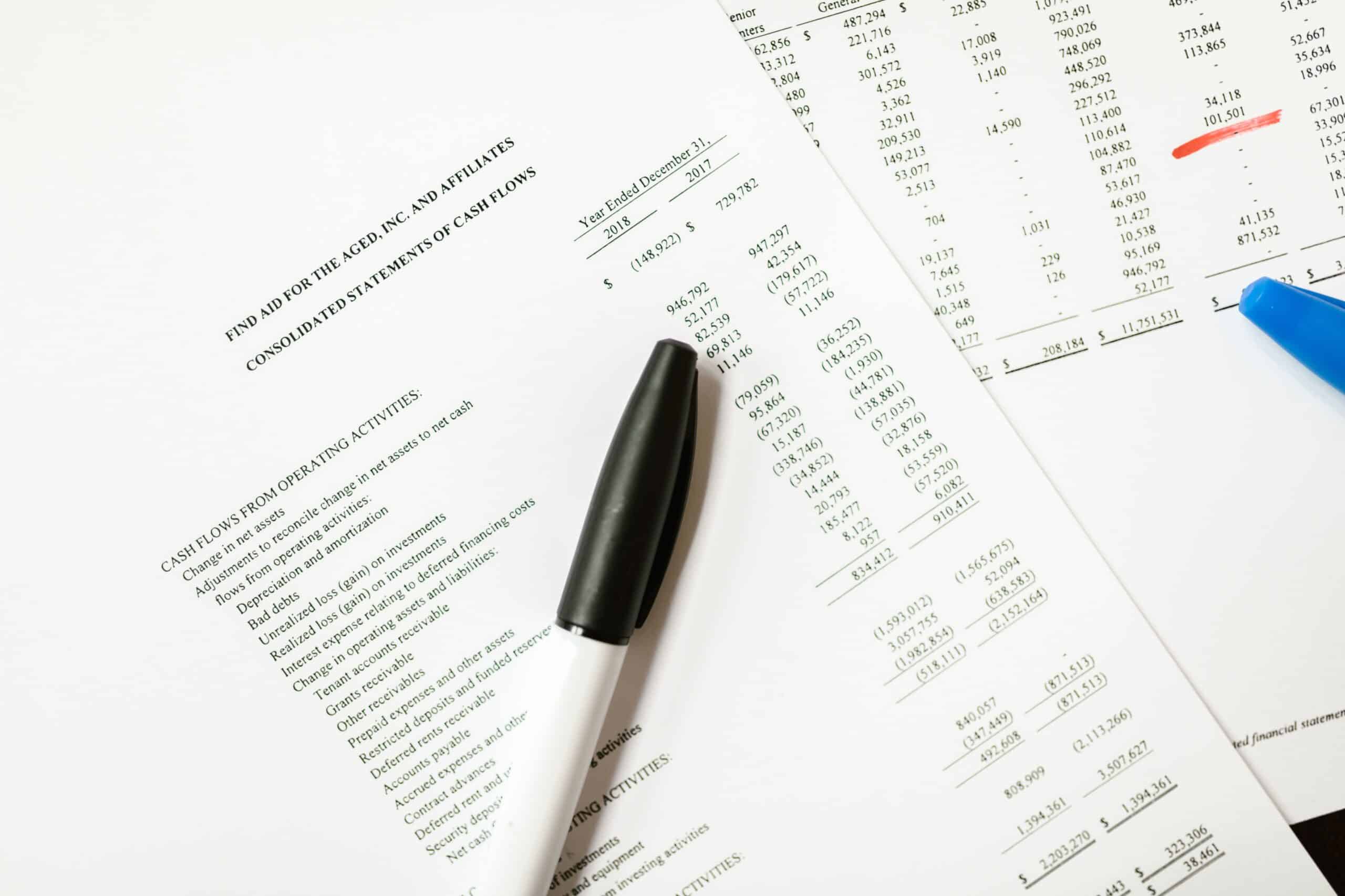 image of an income statement with a black marker